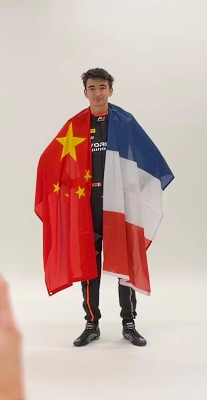 Enzo Deligny holding French and Chinese flags, representing his dual heritage